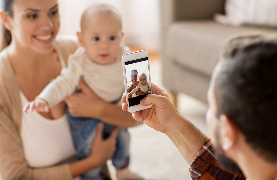 Man photographing family